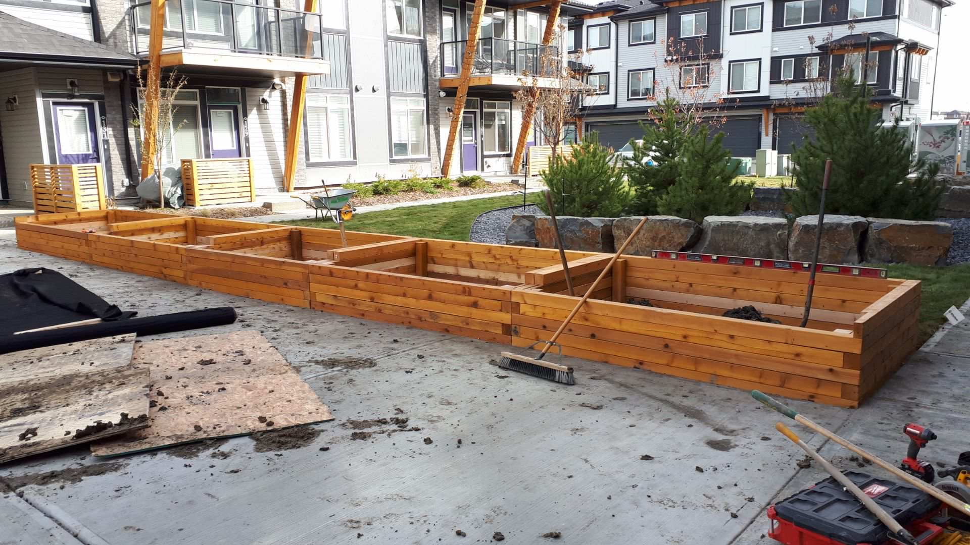 Long cedar raised planter run installed at a new townhome complex