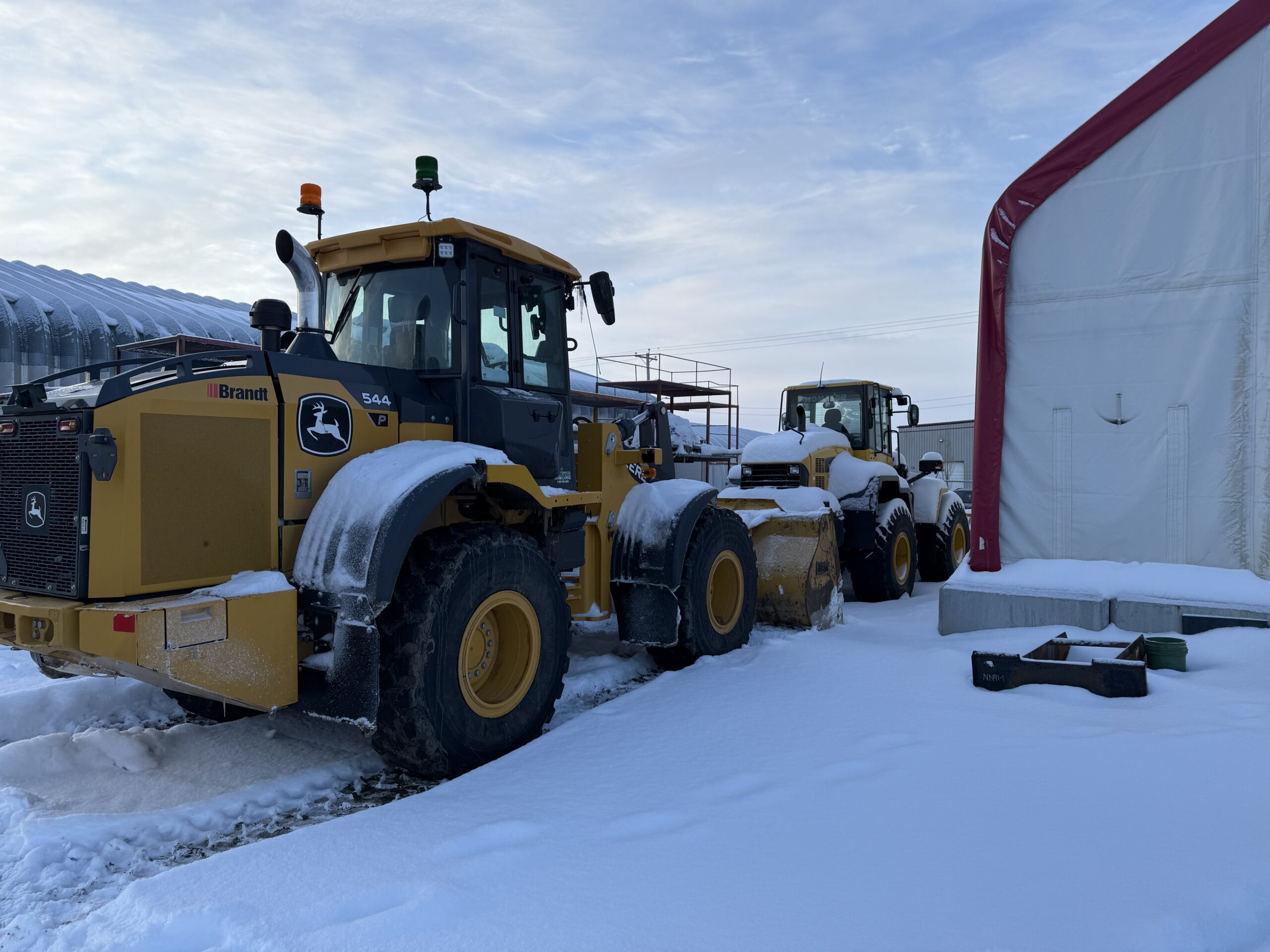 Loader staged at the shop before a snow event